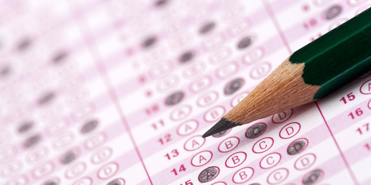 green pencil on pink standardized test form