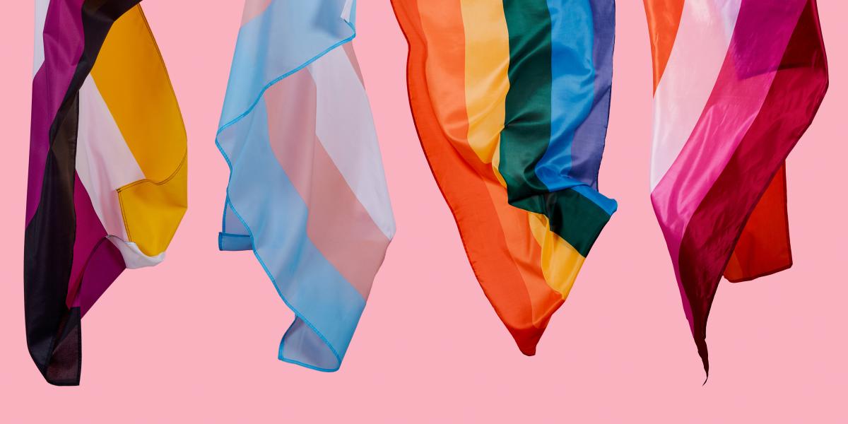 image of several multicolor LGBTQIA flags