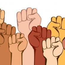 Illustration of different colored fists all raised in the air
