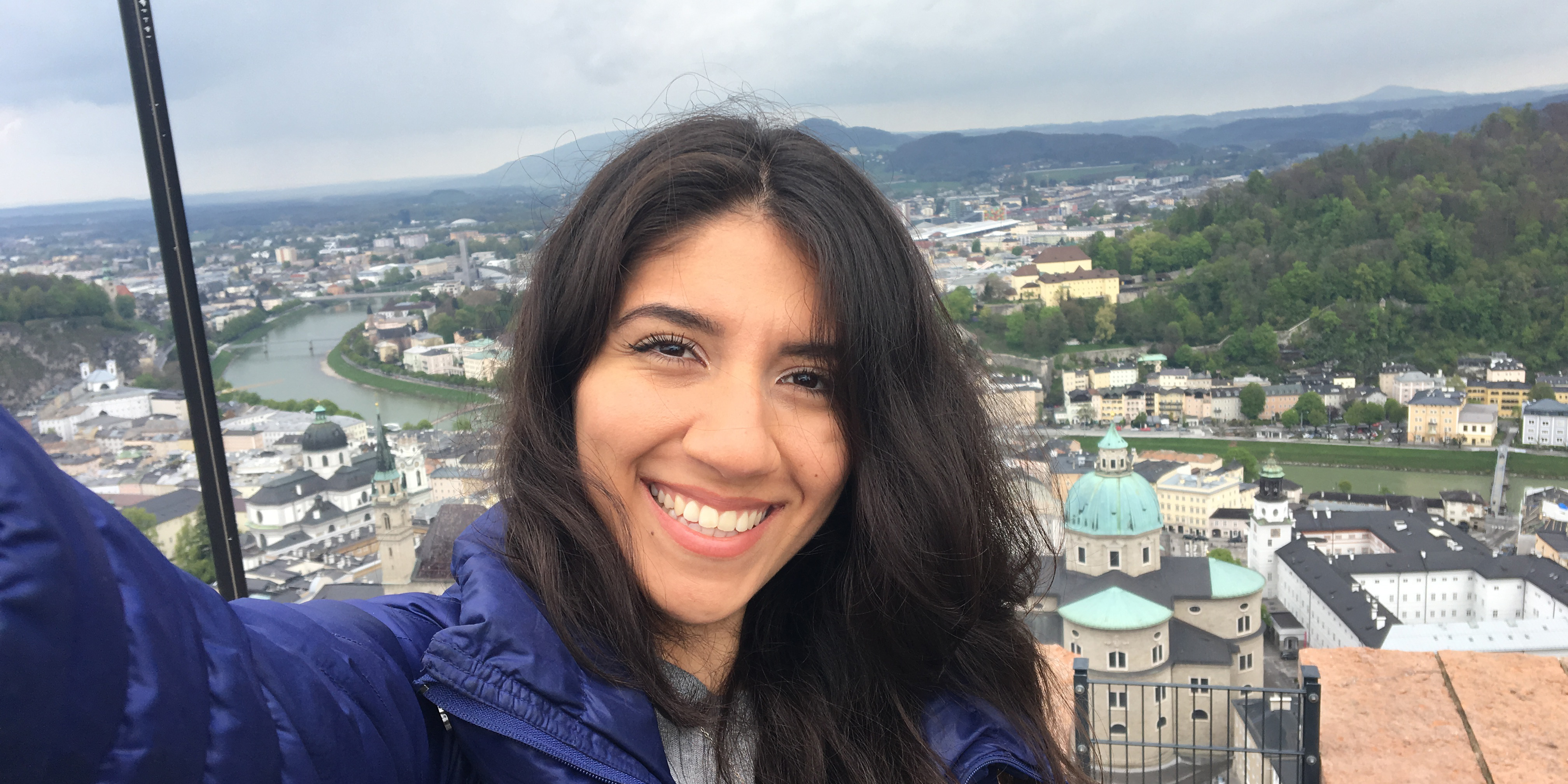 Student taking a selfie with a valley in the background