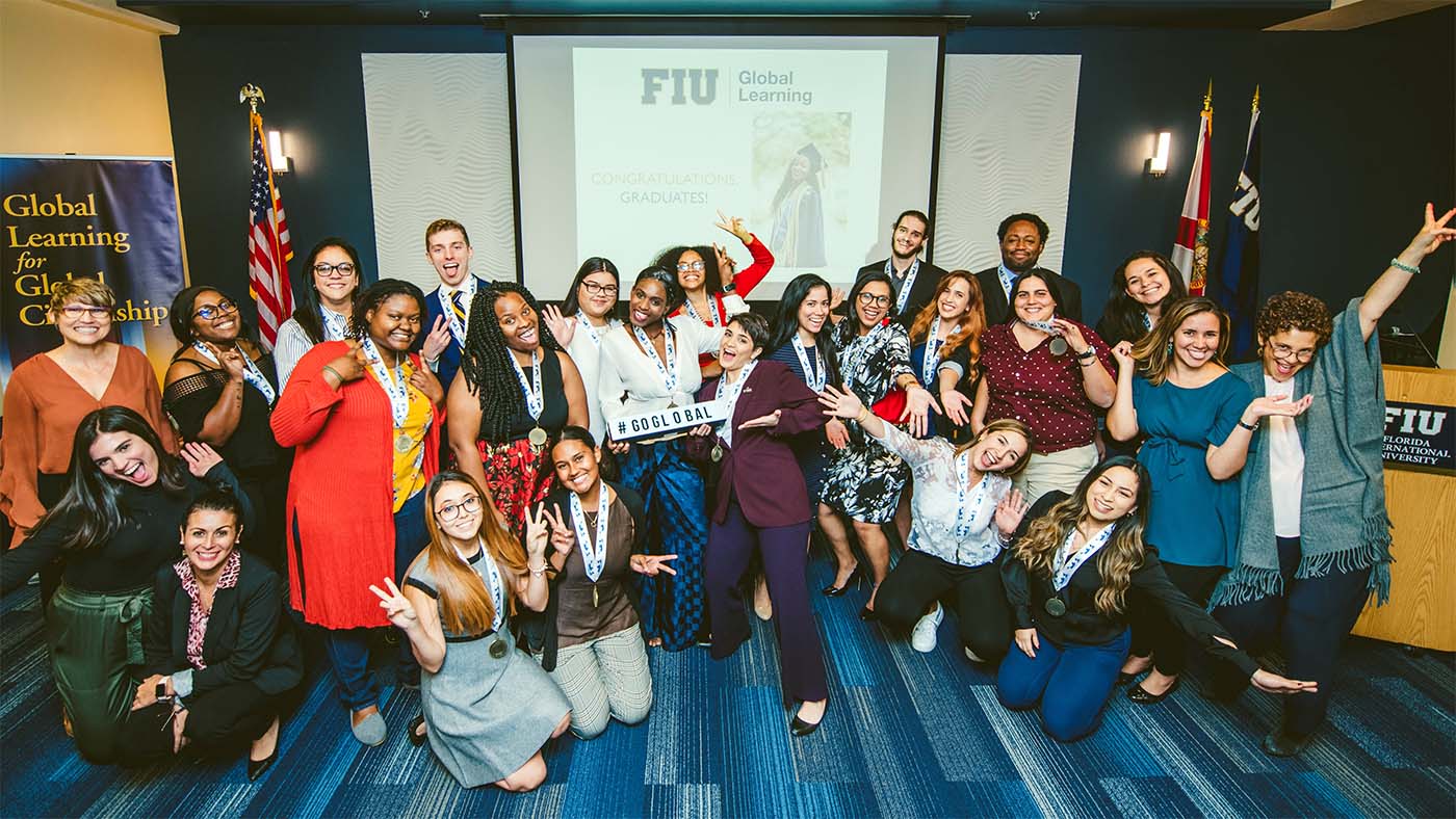 Graduates and global learning staff celebrating their Global Learning Medallion