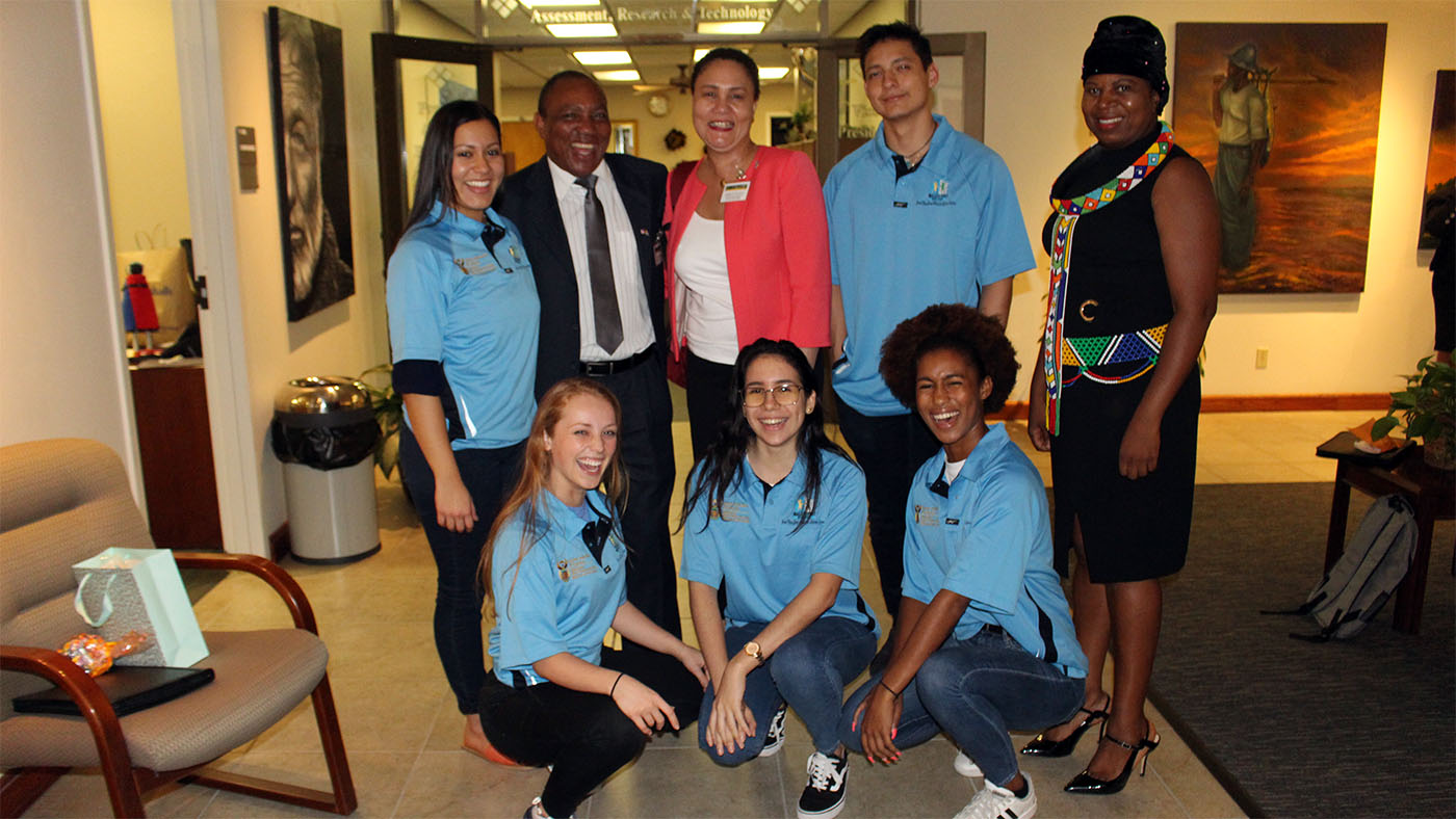 Santa Fe student ambassadors pose with two representatives from CCAP South Africa