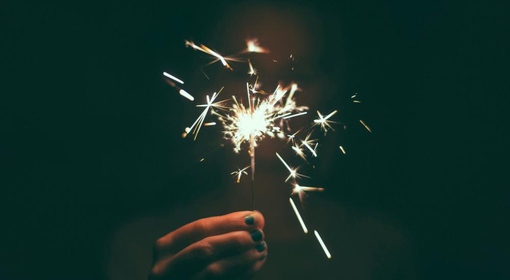 Person holding a sparkler 