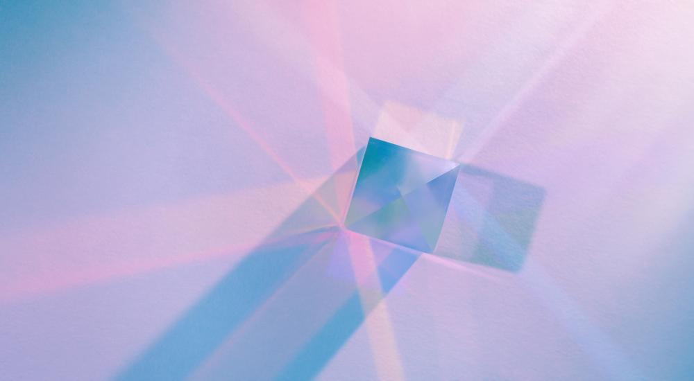 cube prism with refracted light in pastel colors