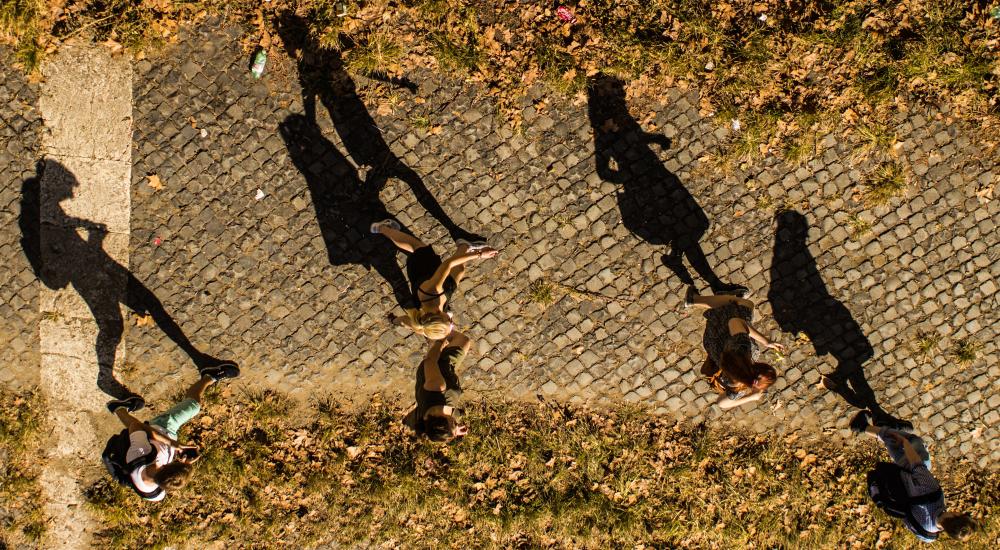 students walking across a campus