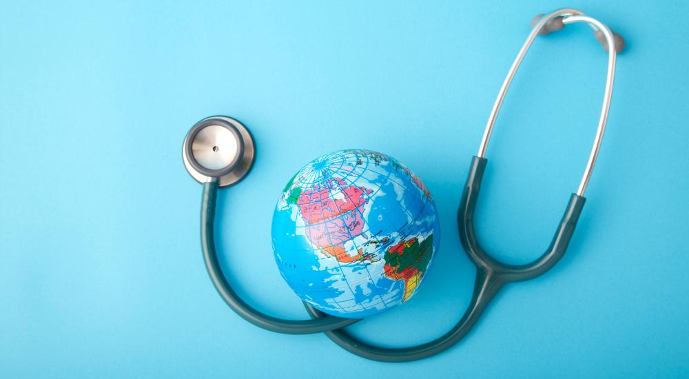 A photo of a stethoscope and globe