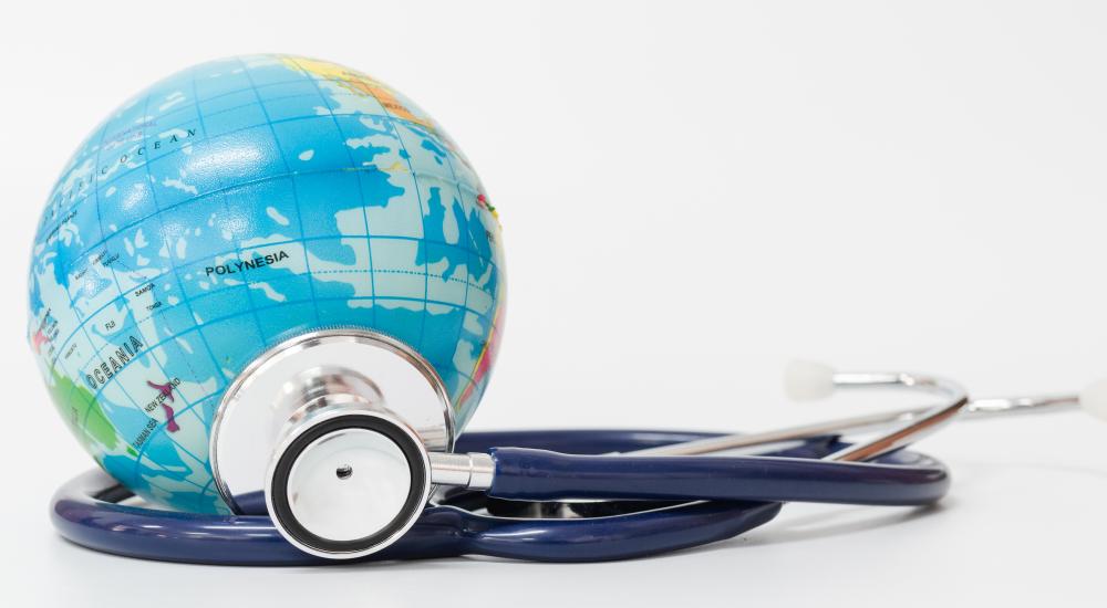 a globe with a stethoscope next to it