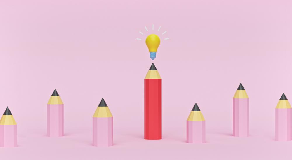 illustration of pink pencils with tall red pencil and light bulb