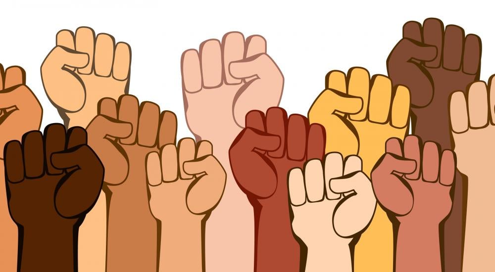 Illustration of different colored fists all raised in the air