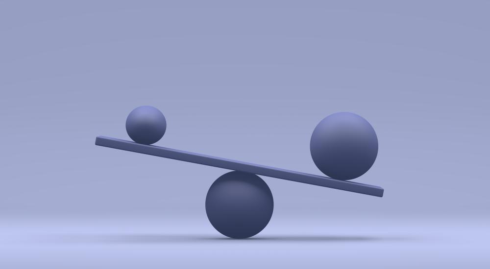 Image of two balls balancing on a board