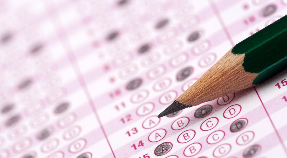 green pencil on pink standardized test form