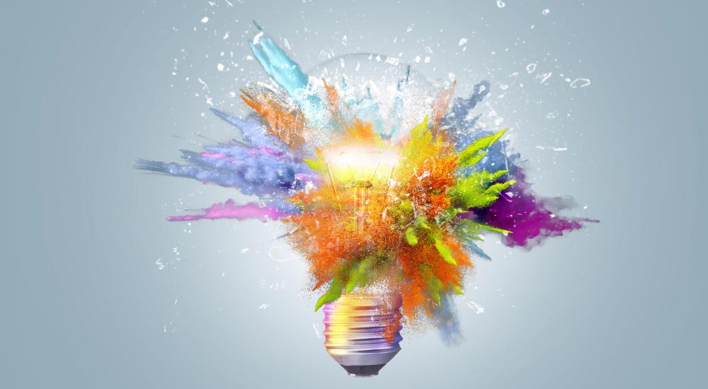 Image of a light bulb exploding with colors