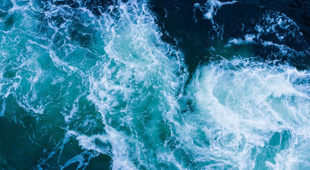 an overhead view of ocean waves