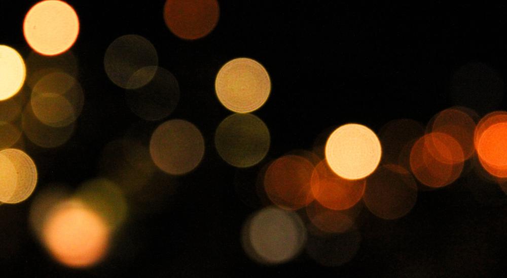 points of light in soft focus against dark background