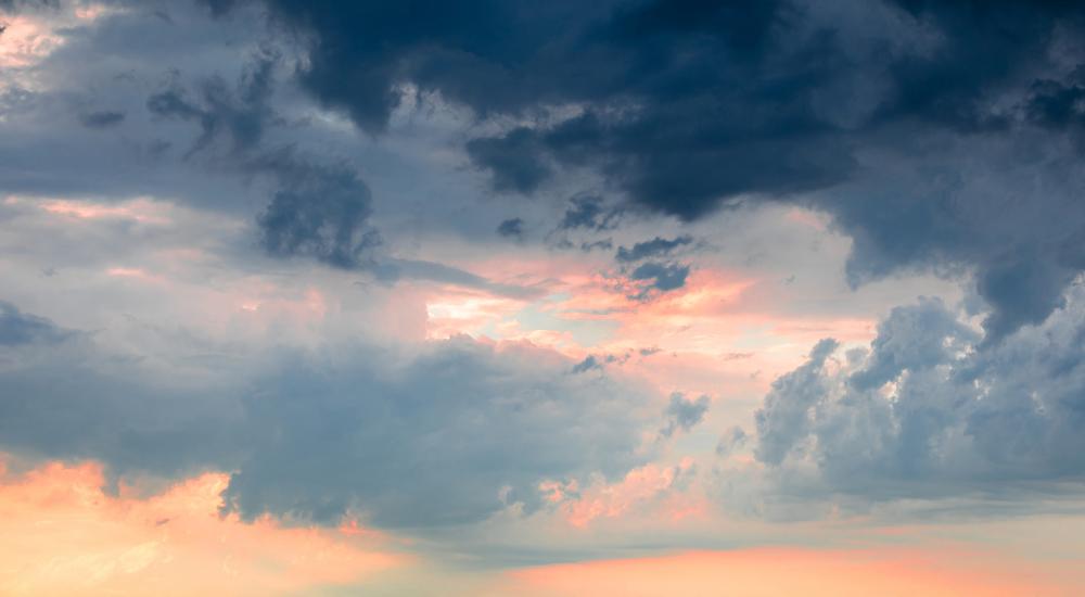 photo of storm clouds against orange sky