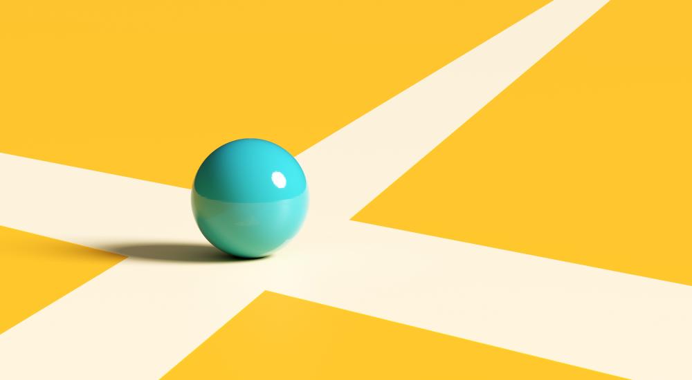 Image of a blue marble sitting at the intersection of two white lines.