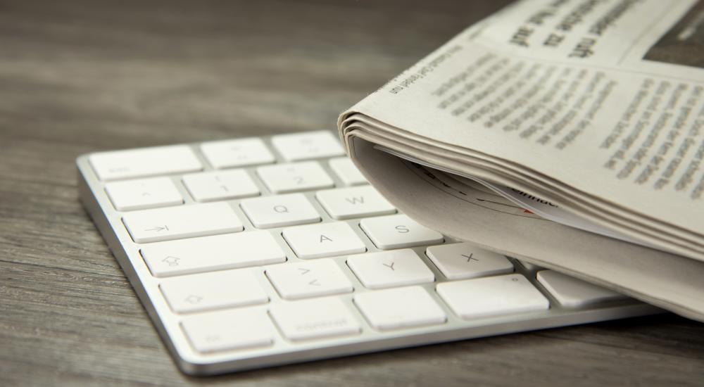 computer keyboard and newspaper