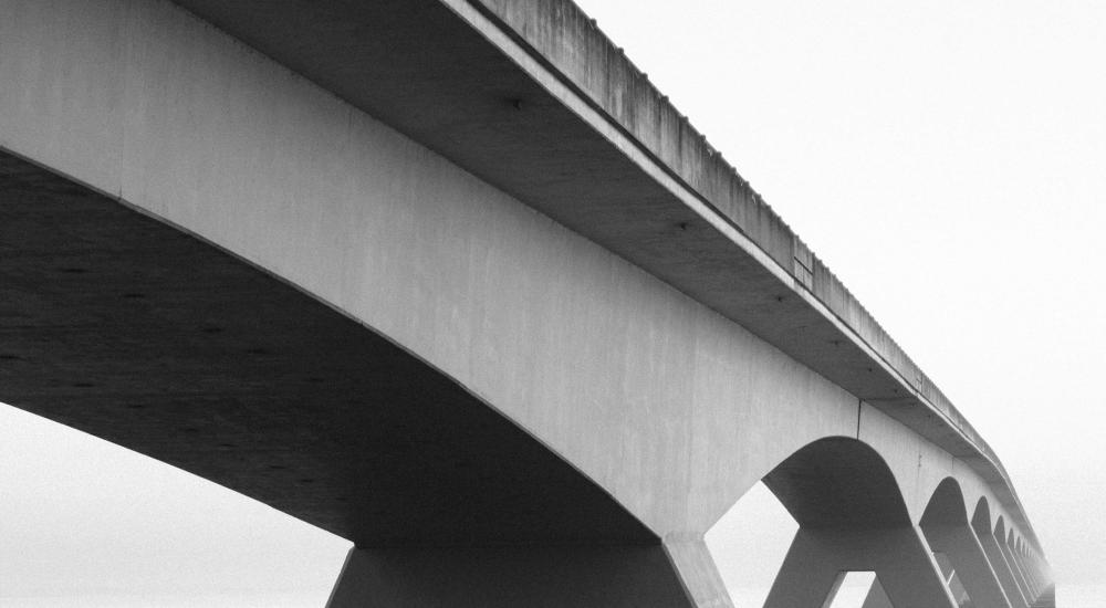 black and white photo of a bridge