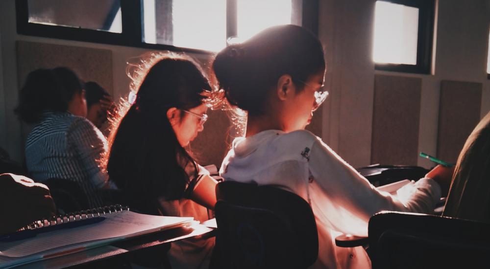 Students sitting at desks in a classroom