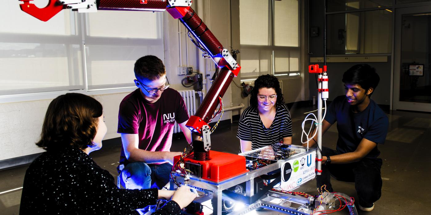 Members of the Northeastern’s Mars Rover Team test a prototype rover for the University Rover Challenge.