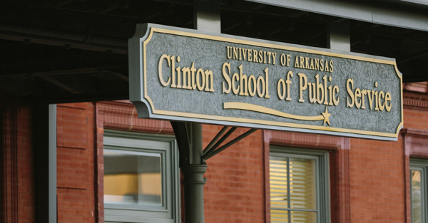 A sign reading Clinton School of Public Service