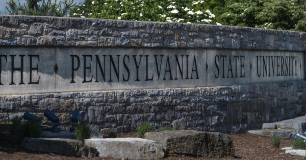 A stone sign reading The Pennsylvania State University