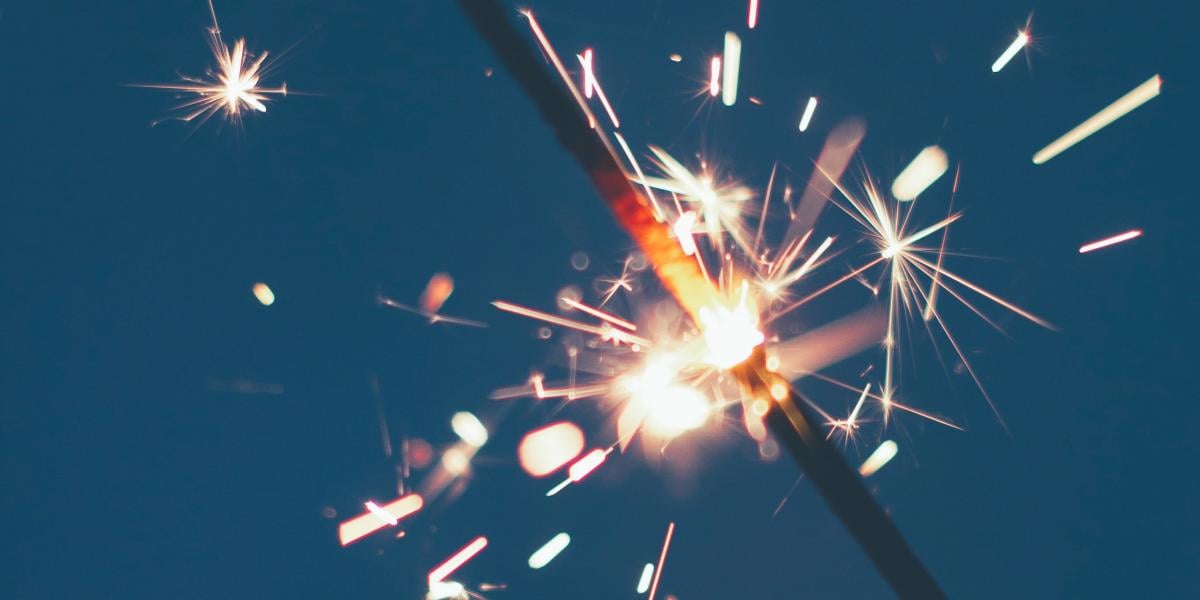 Sparkler against a blue background