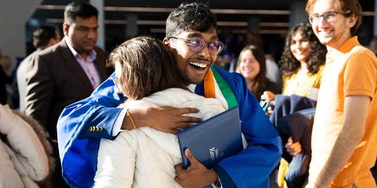 University of Kentucky graduate hugs his mother