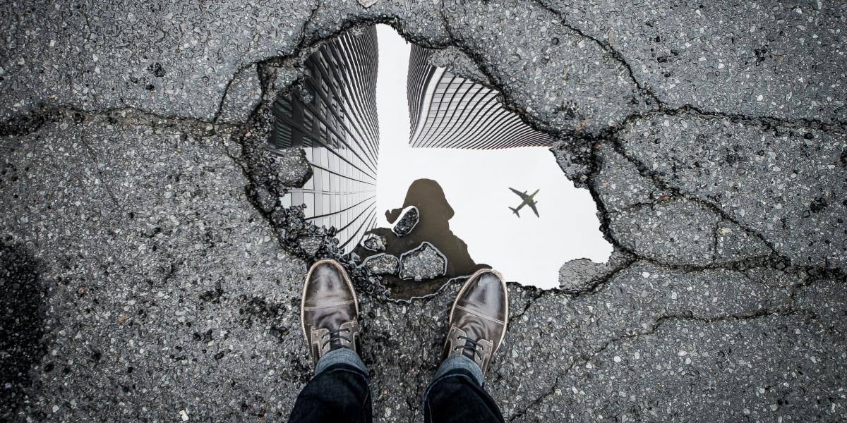 Reflection of a plane in a puddle