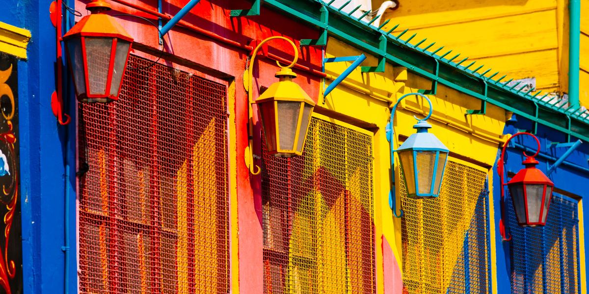 photo of brightly painted building with lamps