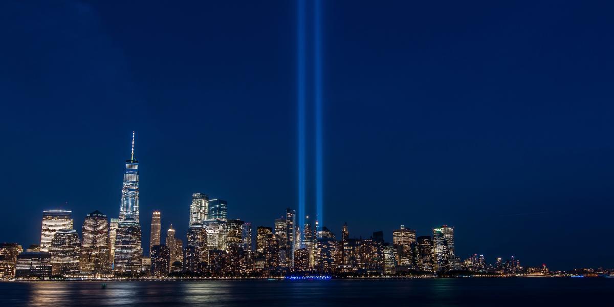 New York City skyline with spotlights where the Twin Towers were.