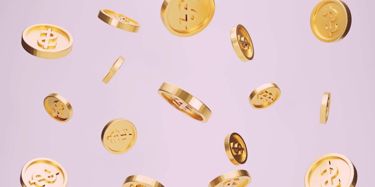 Coins floating against a pink background