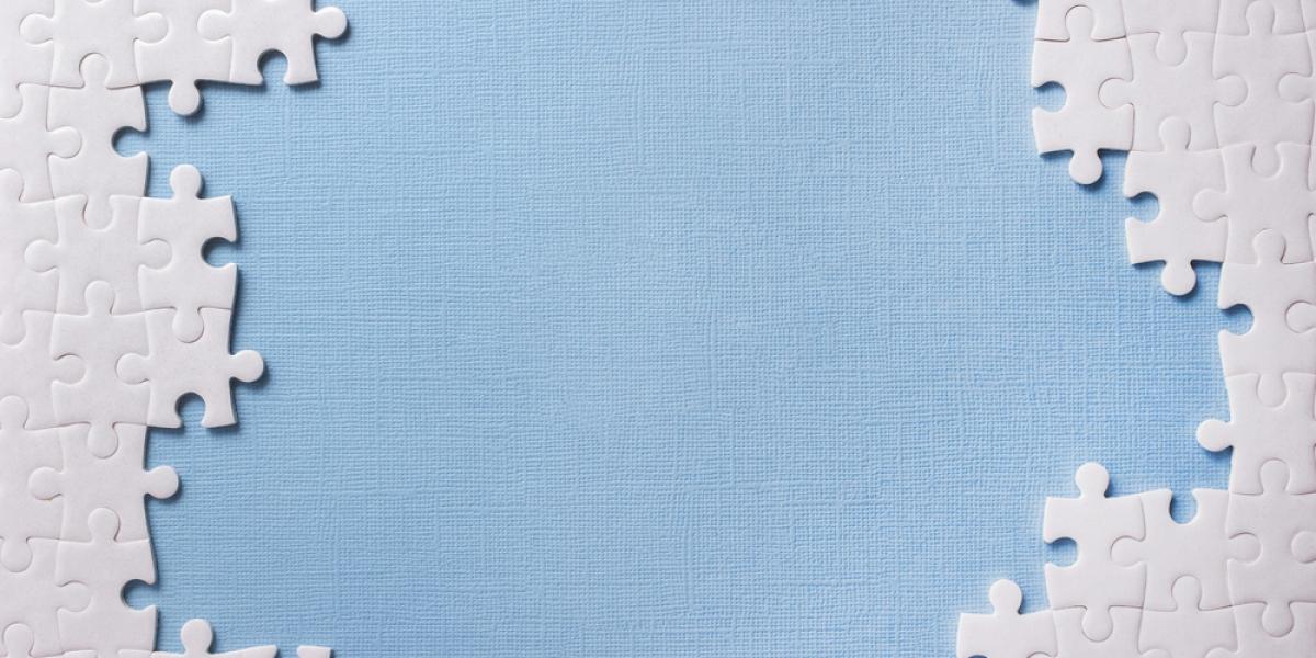 uncompleted blank puzzle on blue background