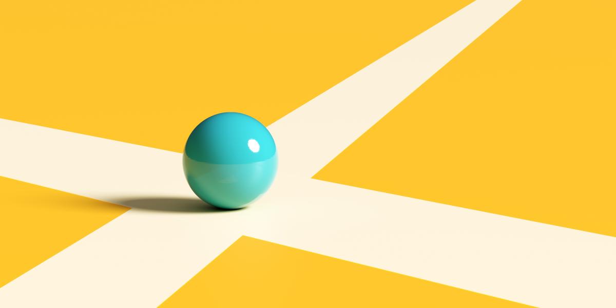 Image of a blue marble sitting at the intersection of two white lines.