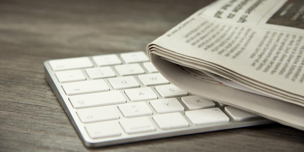 computer keyboard and newspaper