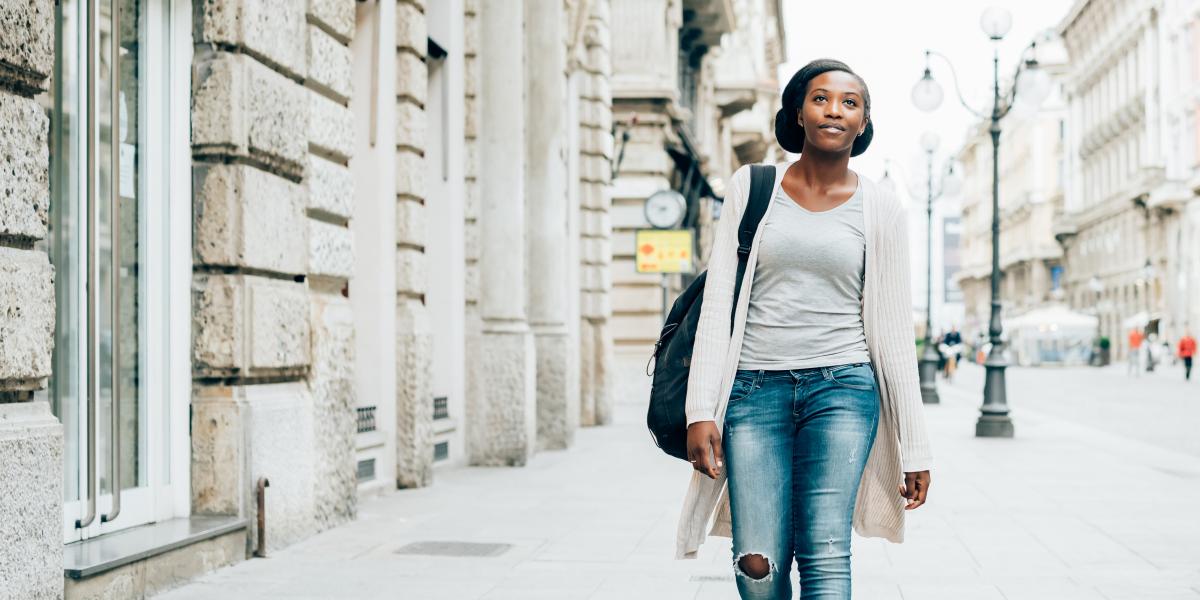 Photo of a student walking down the street