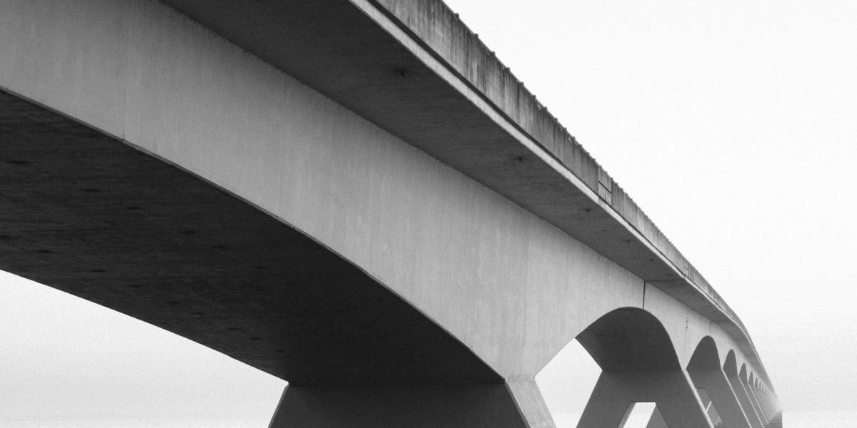 black and white photo of a bridge
