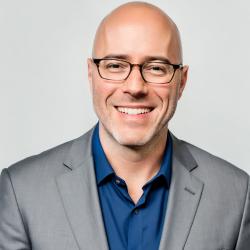 man smiling at camera for photo