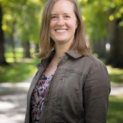 picture of louisa ehrlich against a landscape of green trees