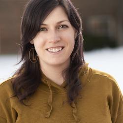 stacey neve with a blurred background of a campus