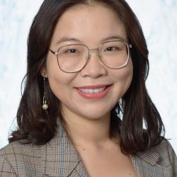profile photo of woman wearing glasses and smiling at the camera