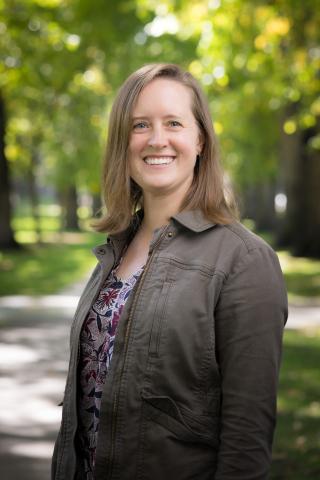 picture of louisa ehrlich against a landscape of green trees