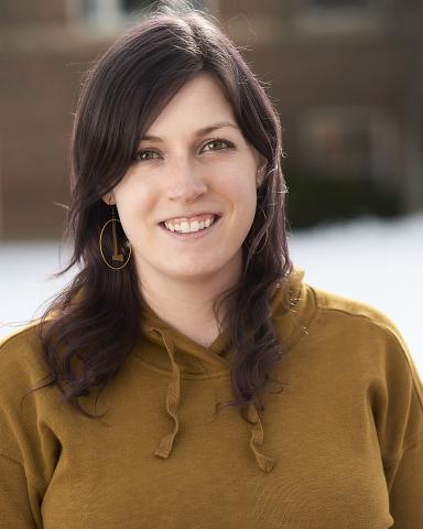 stacey neve with a blurred background of a campus