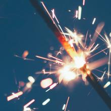 Sparkler against a blue background