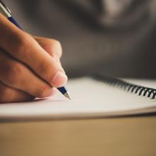 Writing in a notebook