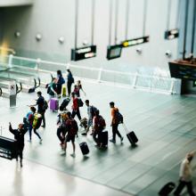Photo of people walking through an airport