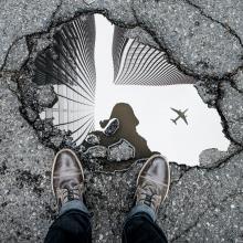 Reflection of a plane in a puddle