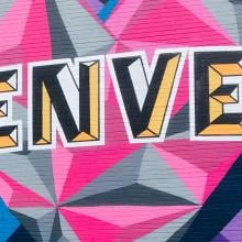 multicolored mural with "Denver" painted on a wall.
