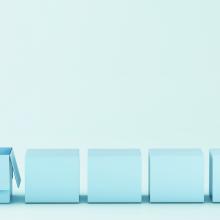 series of blue boxes with light bulb emerging from one