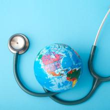 A photo of a stethoscope and globe